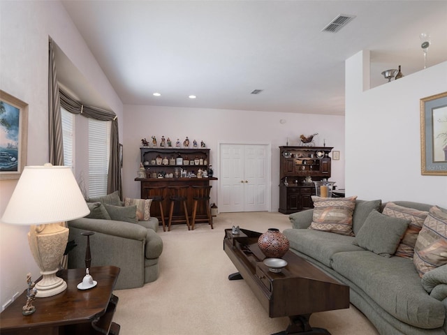 10712 SW 12th Ter, Micanopy, FL 32667 - living room featuring light colored carpet and a bar