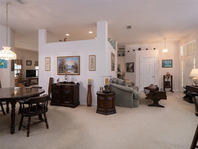 10712 SW 12th Ter, Micanopy, FL 32667 - living room featuring light carpet, a chandelier, baseboards, and recessed lighting