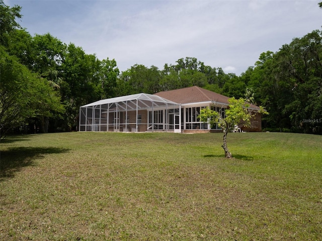 10712 SW 12th Ter, Micanopy, FL 32667 - view of grassy yard featuring a lanai
