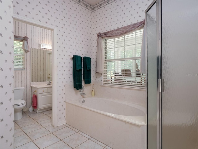 10712 SW 12th Ter, Micanopy, FL 32667 - full bathroom featuring wallpapered walls, a bath, vanity, toilet, and tile patterned floors