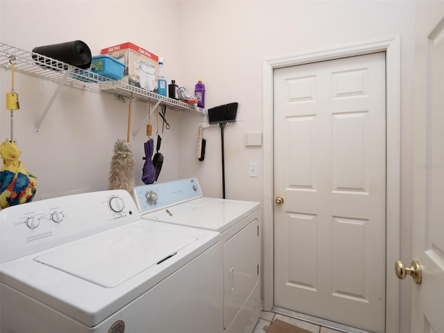 10712 SW 12th Ter, Micanopy, FL 32667 - laundry room with washer and clothes dryer and light tile patterned floors