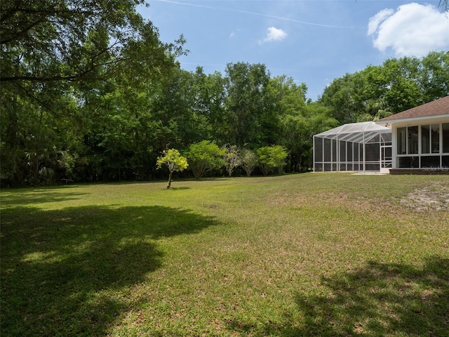 10712 SW 12th Ter, Micanopy, FL 32667 - view of grassy yard featuring a lanai