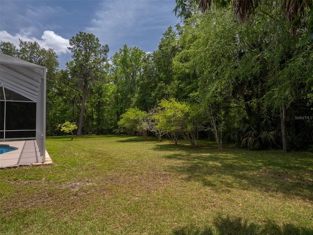 10712 SW 12th Ter, Micanopy, FL 32667 - view of green lawn with an outdoor pool