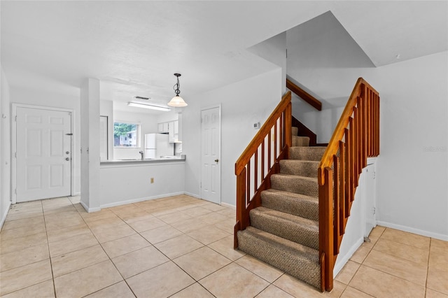 2219 SW 39th Way, Gainesville, FL 32607 - stairs with tile patterned flooring and baseboards