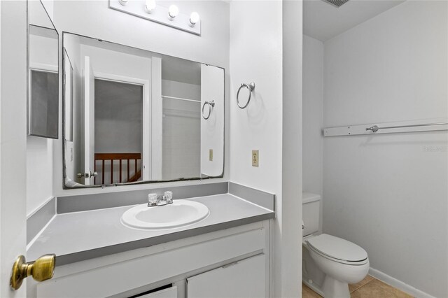 2219 SW 39th Way, Gainesville, FL 32607 - bathroom featuring toilet, tile patterned flooring, and vanity
