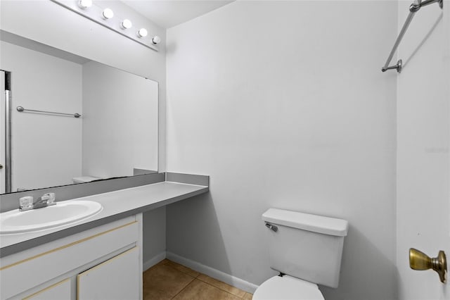 2219 SW 39th Way, Gainesville, FL 32607 - half bathroom with toilet, tile patterned flooring, baseboards, and vanity