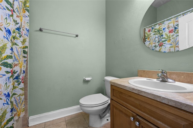 bathroom featuring tile patterned flooring, toilet, vanity, baseboards, and a shower with curtain