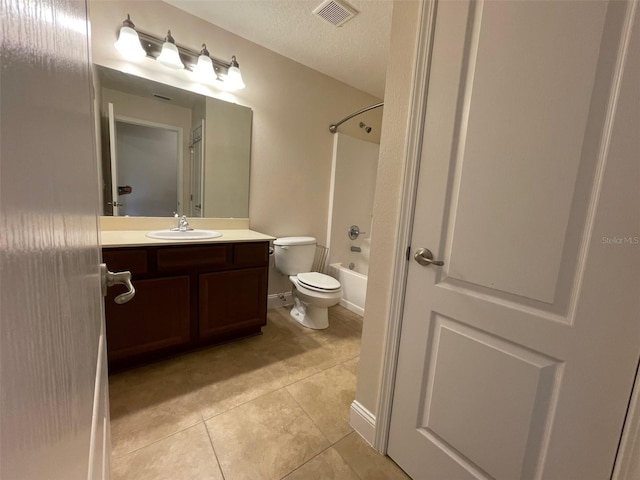8216 NW 54th St, Gainesville, FL 32653 - bathroom featuring tile patterned flooring, vanity, toilet, washtub / shower combination, and a textured ceiling