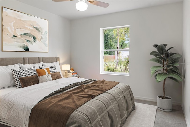 bedroom featuring carpet floors, baseboards, and ceiling fan