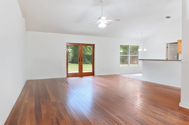 unfurnished living room featuring lofted ceiling, a ceiling fan, wood-type flooring, french doors, and baseboards