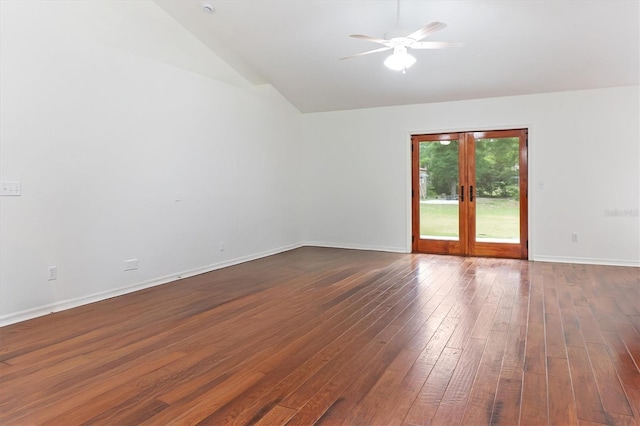 empty room featuring vaulted ceiling, french doors, a ceiling fan, dark wood-style floors, and baseboards