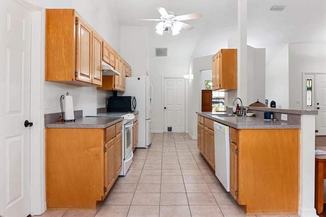 kitchen with white appliances, a sink, a ceiling fan, light tile patterned floors, and lofted ceiling
