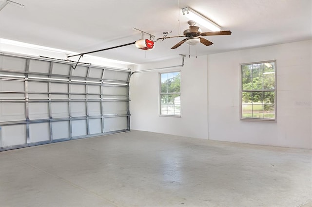 garage featuring a garage door opener and a ceiling fan
