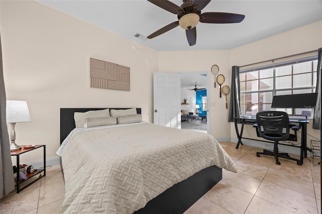 7202 NW 52nd Ter, Gainesville, FL 32653 - bedroom featuring light tile patterned floors, baseboards, a desk, and a ceiling fan