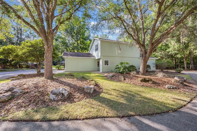 7202 NW 52nd Ter, Gainesville, FL 32653 - view of side of home featuring a yard