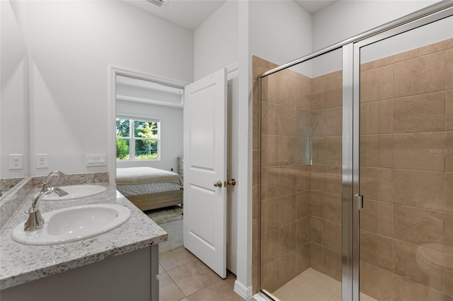 5237 NW 48th Pl, Ocala, FL 34482 - full bath with double vanity, a stall shower, tile patterned flooring, and ensuite bath