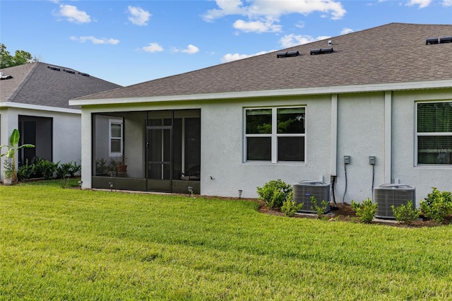 5237 NW 48th Pl, Ocala, FL 34482 - rear view of property with roof with shingles, a sunroom, a yard, and stucco siding