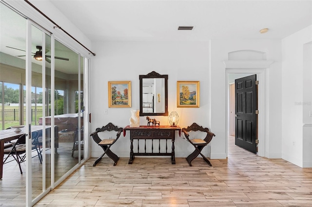 23510 Oak Prairie Cir, Sorrento, FL 32776 - corridor featuring light wood-style floors and baseboards