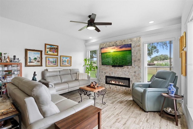 23510 Oak Prairie Cir, Sorrento, FL 32776 - living area with ceiling fan, a fireplace, recessed lighting, and light wood-type flooring