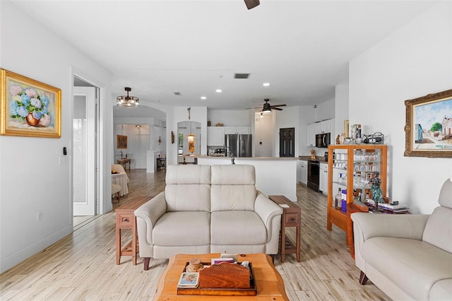 23510 Oak Prairie Cir, Sorrento, FL 32776 - living area featuring ceiling fan, light wood-type flooring, recessed lighting, and baseboards