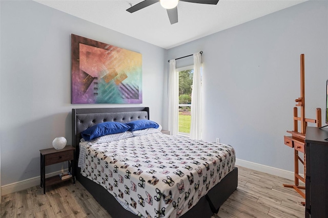 23510 Oak Prairie Cir, Sorrento, FL 32776 - bedroom with wood finished floors, baseboards, and a ceiling fan