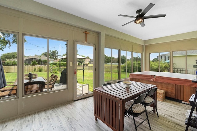23510 Oak Prairie Cir, Sorrento, FL 32776 - sunroom with a hot tub, ceiling fan, and healthy amount of natural light