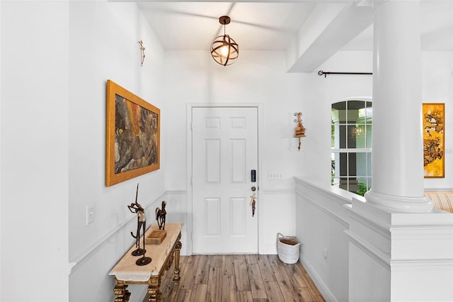 23510 Oak Prairie Cir, Sorrento, FL 32776 - entrance foyer featuring decorative columns and light wood-style floors