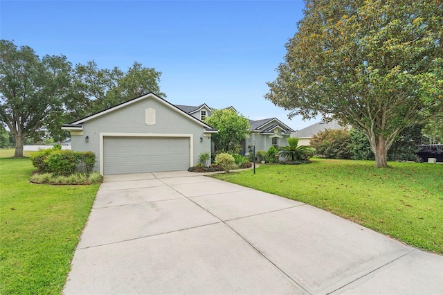 23510 Oak Prairie Cir, Sorrento, FL 32776 - view of front of home featuring a garage, driveway, a front yard, and stucco siding