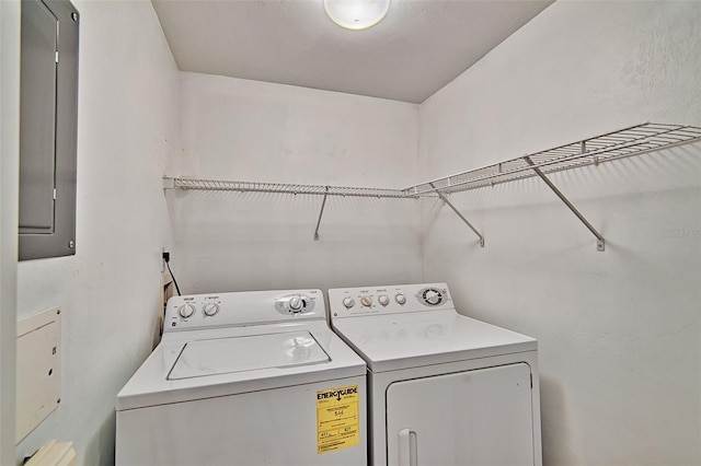 clothes washing area featuring washing machine and dryer