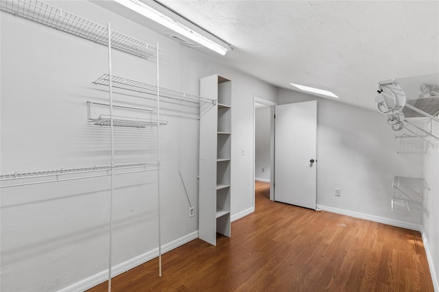 spacious closet with wood finished floors