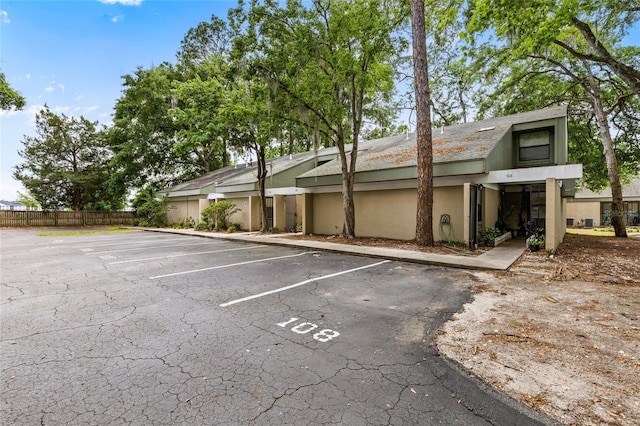 uncovered parking lot with fence