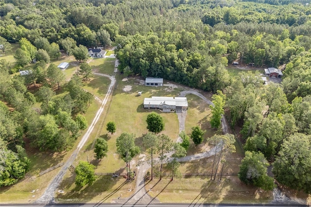 view of property location featuring a forest