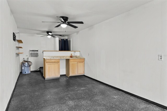 unfurnished living room featuring a ceiling fan, an AC wall unit, and baseboards