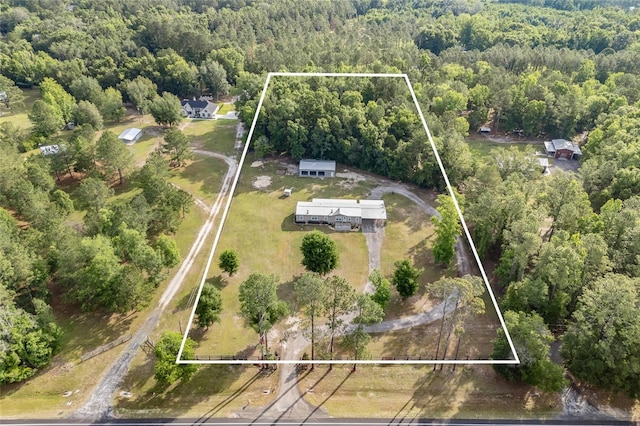 view of property location with a forest and property boundaries highlighted