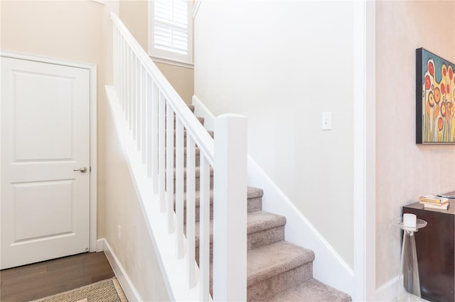 3242 NW 23rd Rd, Gainesville, FL 32605 - staircase featuring wood finished floors