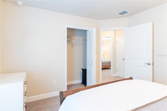 3242 NW 23rd Rd, Gainesville, FL 32605 - bedroom featuring light colored carpet, a closet, and baseboards