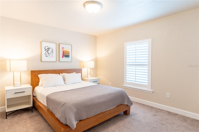 3242 NW 23rd Rd, Gainesville, FL 32605 - bedroom with carpet flooring and baseboards