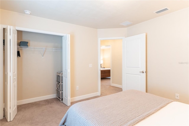 3242 NW 23rd Rd, Gainesville, FL 32605 - bedroom featuring light colored carpet, a closet, and baseboards