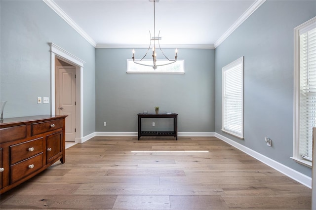 13209 SW 3rd Ln, Newberry, FL 32669 - unfurnished dining area with ornamental molding, light wood-type flooring, a chandelier, and baseboards