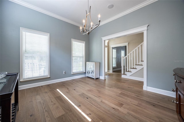 13209 SW 3rd Ln, Newberry, FL 32669 - unfurnished dining area featuring ornamental molding, a chandelier, healthy amount of natural light, baseboards, and stairs