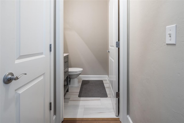 13209 SW 3rd Ln, Newberry, FL 32669 - bathroom with vanity, baseboards, and toilet
