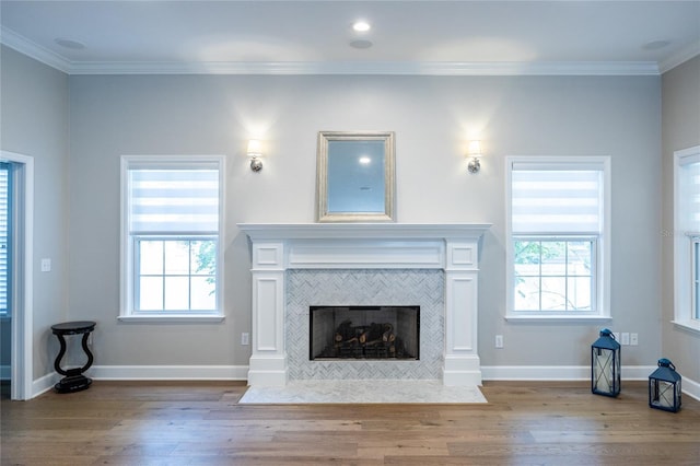 13209 SW 3rd Ln, Newberry, FL 32669 - unfurnished living room with wood finished floors, plenty of natural light, a tile fireplace, and ornamental molding