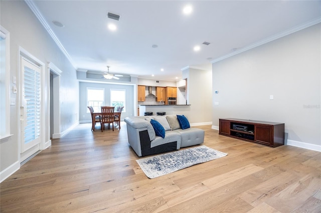 13209 SW 3rd Ln, Newberry, FL 32669 - living area featuring ornamental molding, a ceiling fan, light wood-style floors, baseboards, and recessed lighting