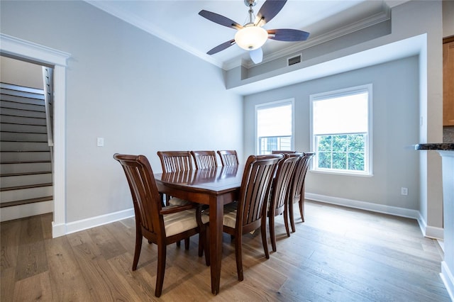 13209 SW 3rd Ln, Newberry, FL 32669 - dining area featuring ornamental molding, light wood finished floors, baseboards, a ceiling fan, and stairway