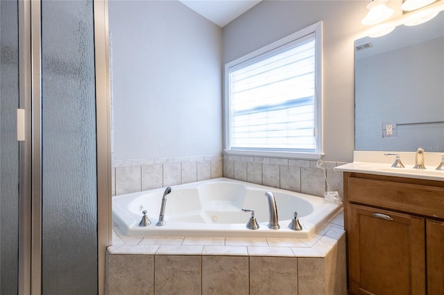 13209 SW 3rd Ln, Newberry, FL 32669 - full bath featuring vanity, a jetted tub, and a stall shower