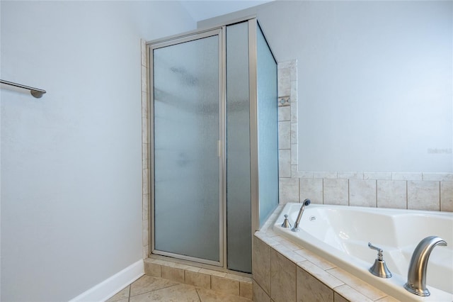 13209 SW 3rd Ln, Newberry, FL 32669 - bathroom with a stall shower, a bath, tile patterned flooring, and baseboards