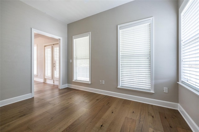 13209 SW 3rd Ln, Newberry, FL 32669 - empty room with wood finished floors and baseboards