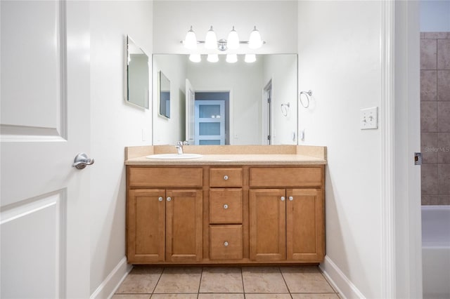 13209 SW 3rd Ln, Newberry, FL 32669 - bathroom featuring vanity, tile patterned floors, baseboards, and a bathtub