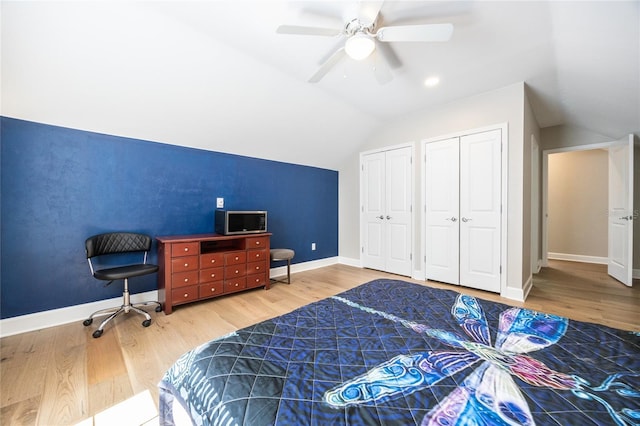 13209 SW 3rd Ln, Newberry, FL 32669 - bedroom featuring vaulted ceiling, multiple closets, wood finished floors, baseboards, and a ceiling fan