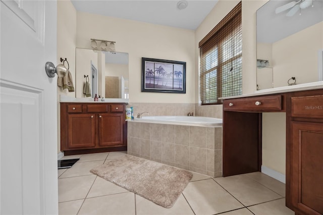 bathroom with a bath, tile patterned floors, vanity, and ceiling fan